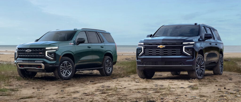 2025 Chevrolet Suburban and Chevrolet Tahoe on a beach