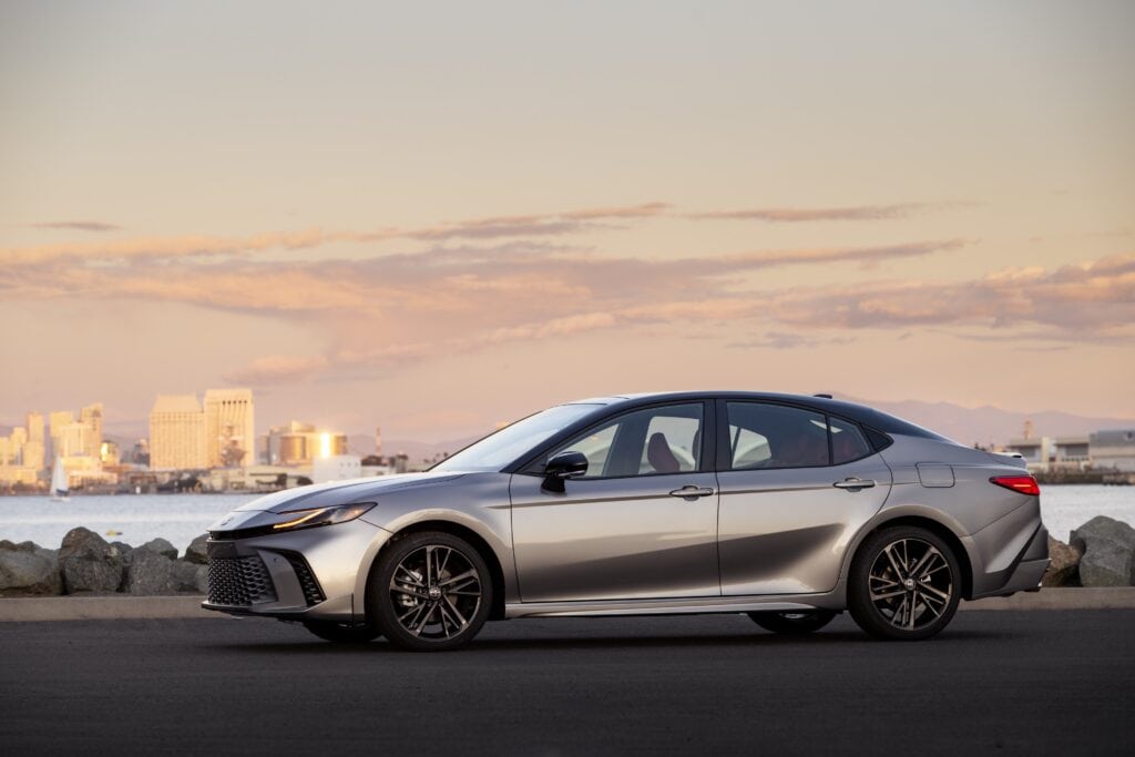 2025 Toyota Camry XSE AWD parked near the Pacific Ocean at sunset