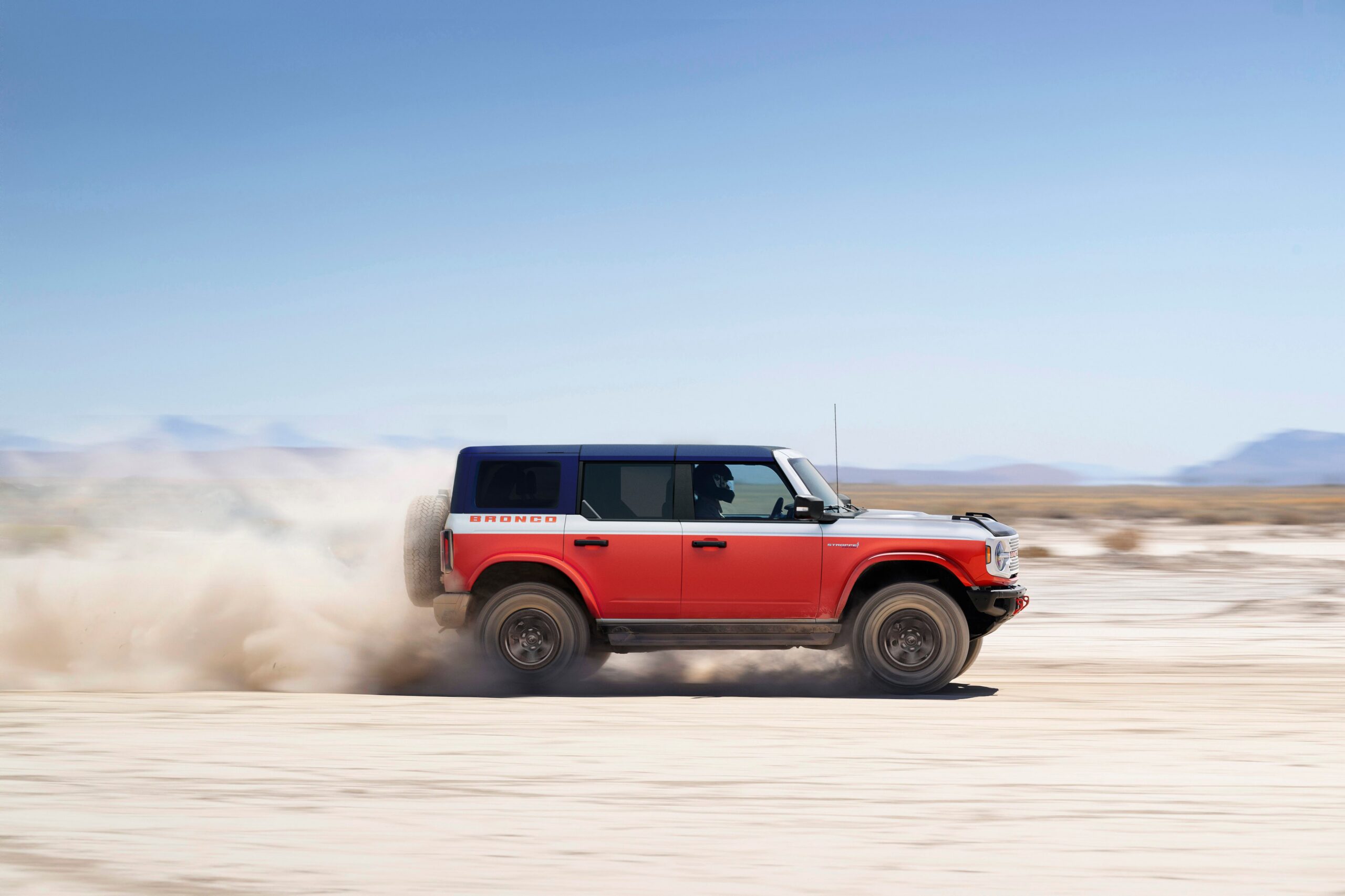 Four-door 2026 Ford Bronco Stroppe Edition in white and orange