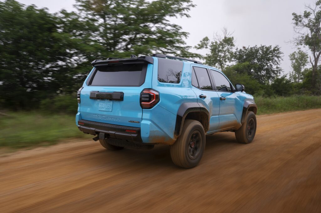 Rear three-quarter view of the 2026 Toyota 4Runner TRD Pro on a dirt road