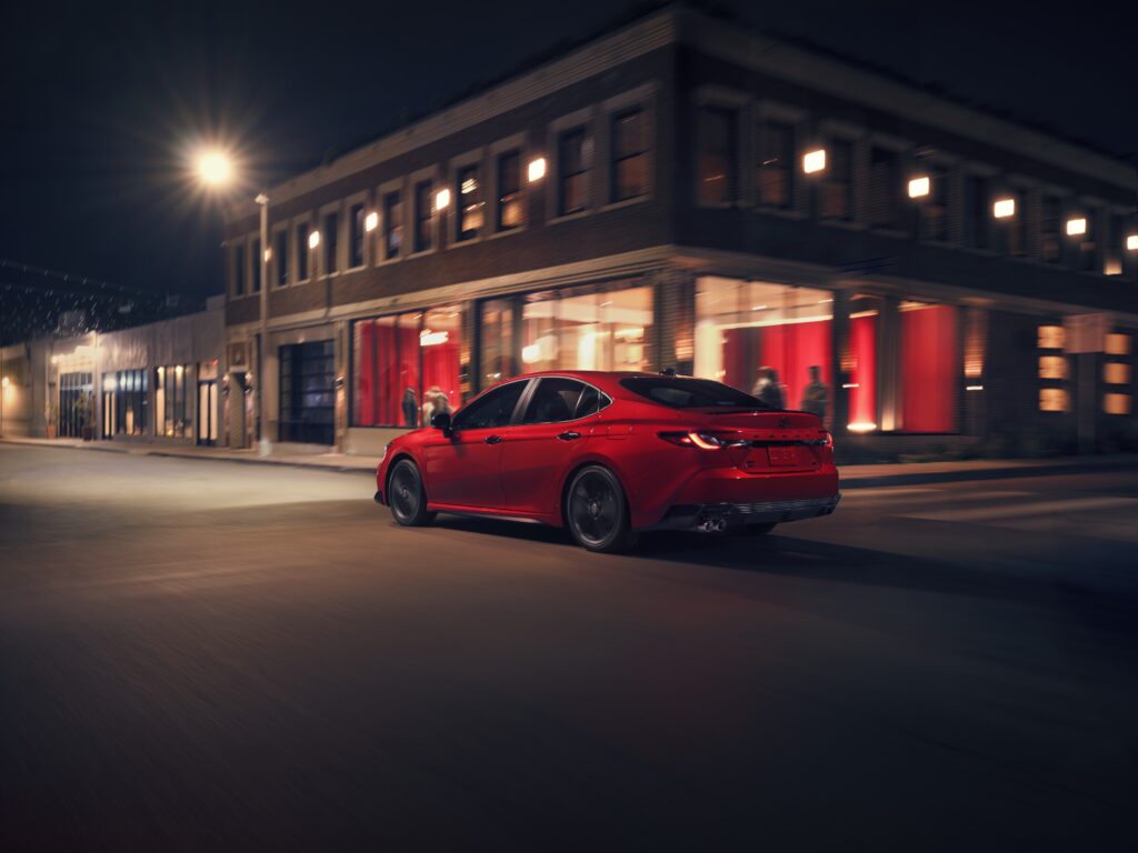 2026 Toyota Camry Nightshade Parked Outside a Restaurant at Night Under Streetlights