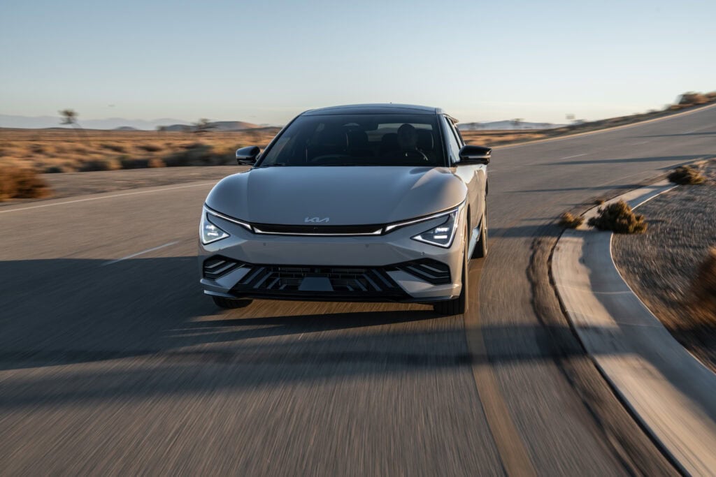2026 Kia EV6 cornering at speed. Kia Is Thinking Outside the Box in America