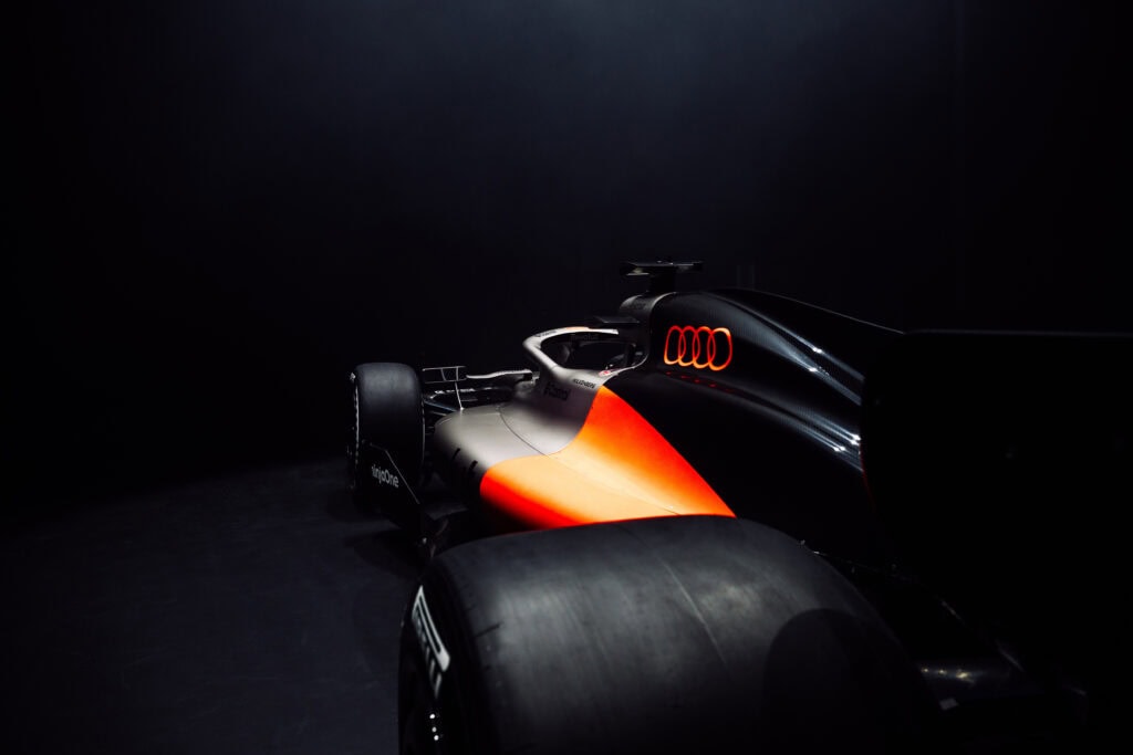 A Closeup View of the Audi Revolut F1 Team R26 Livery looking at the tire and back portion of the vehicle