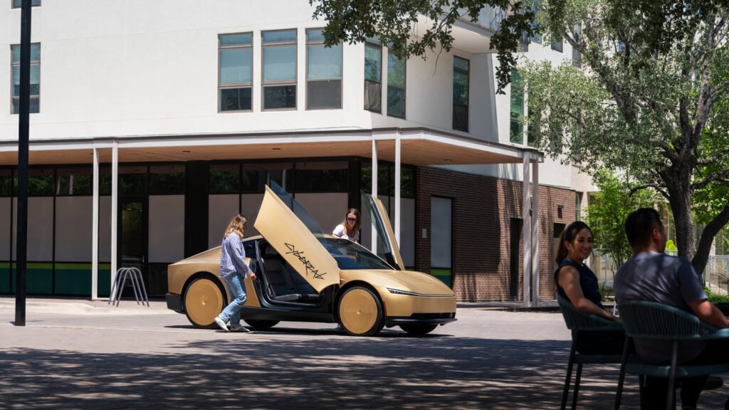 Cyber cab picking up riders Tesla