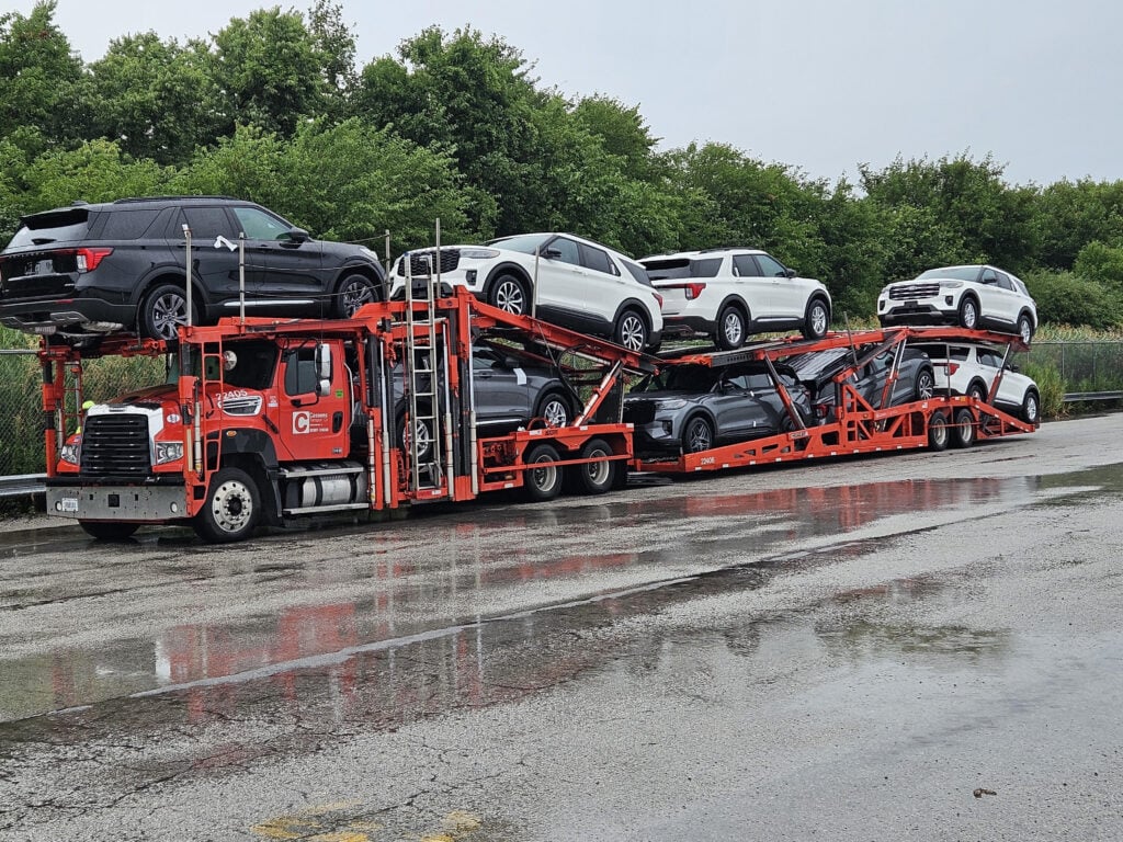 Chicago assembly production vehicles on a transporter being shipped out of Chicago