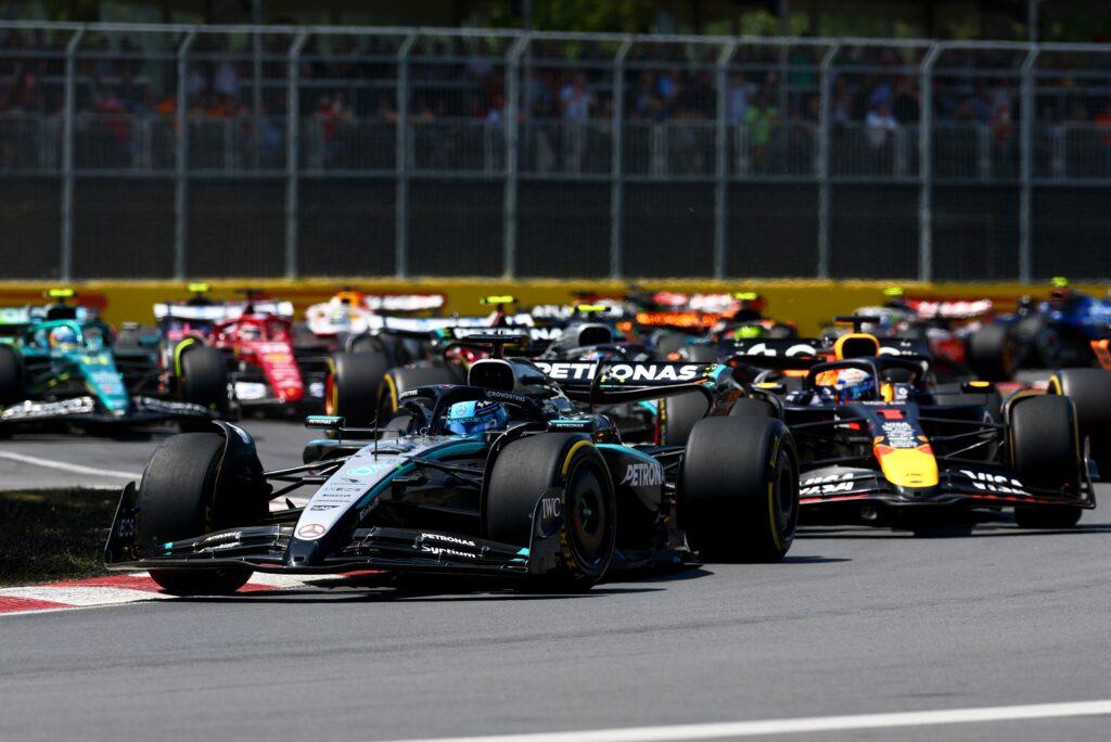 F1 cars race on the track battling eachother