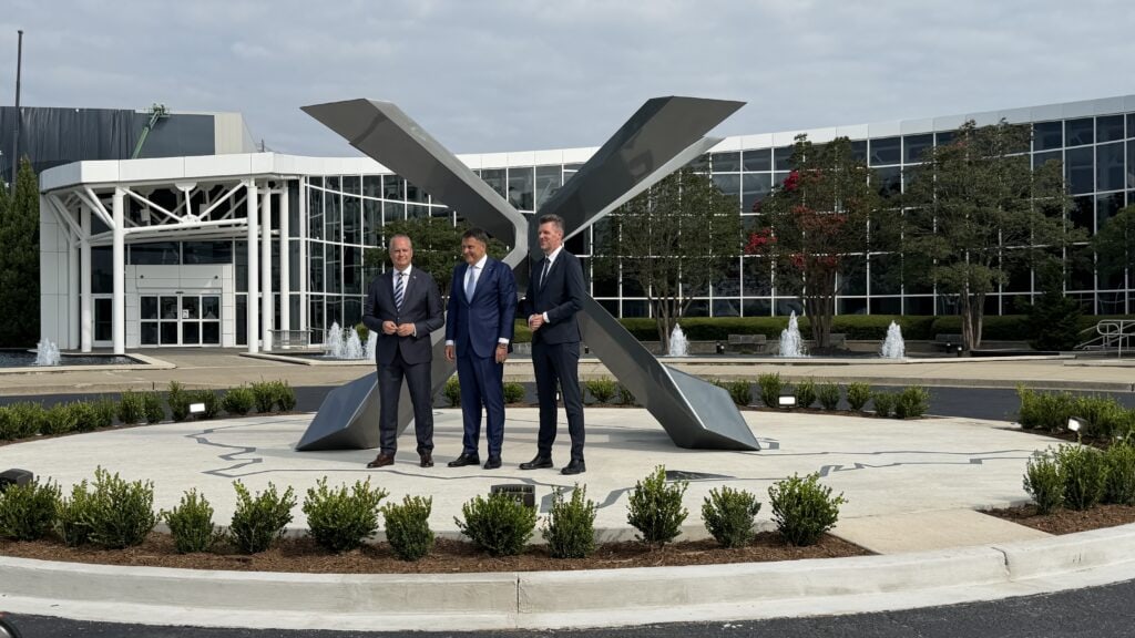 BMW's executive team members presenting the new statue of X outside the Spartanburg factory