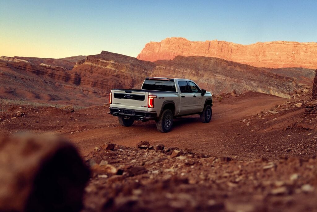 2027 Chevrolet Silverado 1500 ZR2 in White Sands. Exterior passenger rear 3/4 beauty shot.