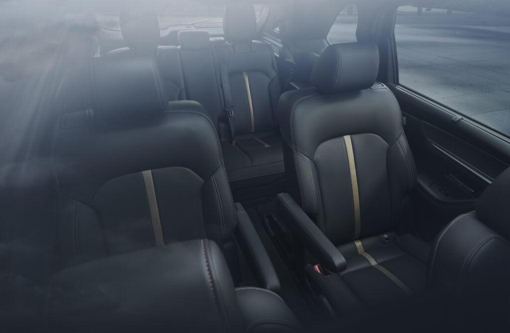 Black Mazda CX-90 PHEV cabin with three rows of seats