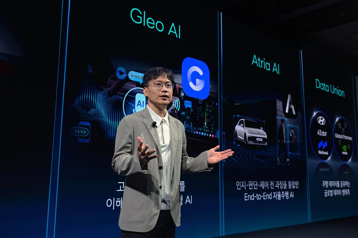 Minwoo Park speaking beside a screen showing Gleo AI and Atria AI.