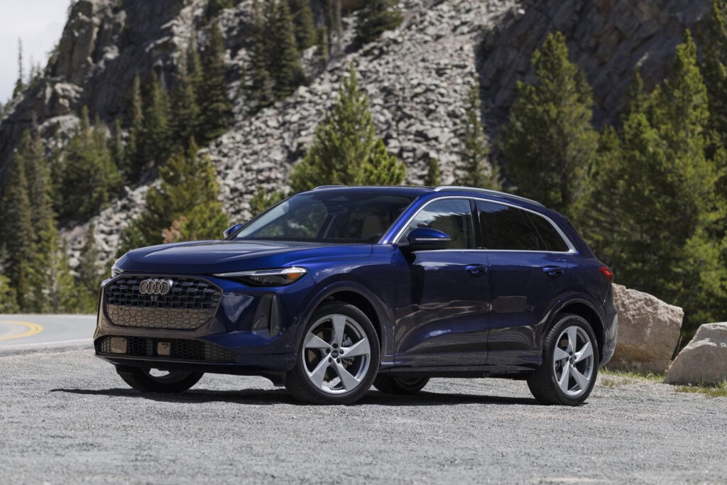 2026 Audi Q5 parked in the mountains amongst trees and rocks