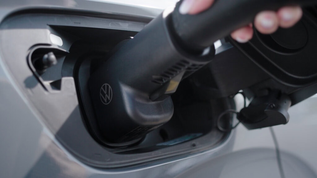 Volkswagen being plugged into Tesla Supercharger