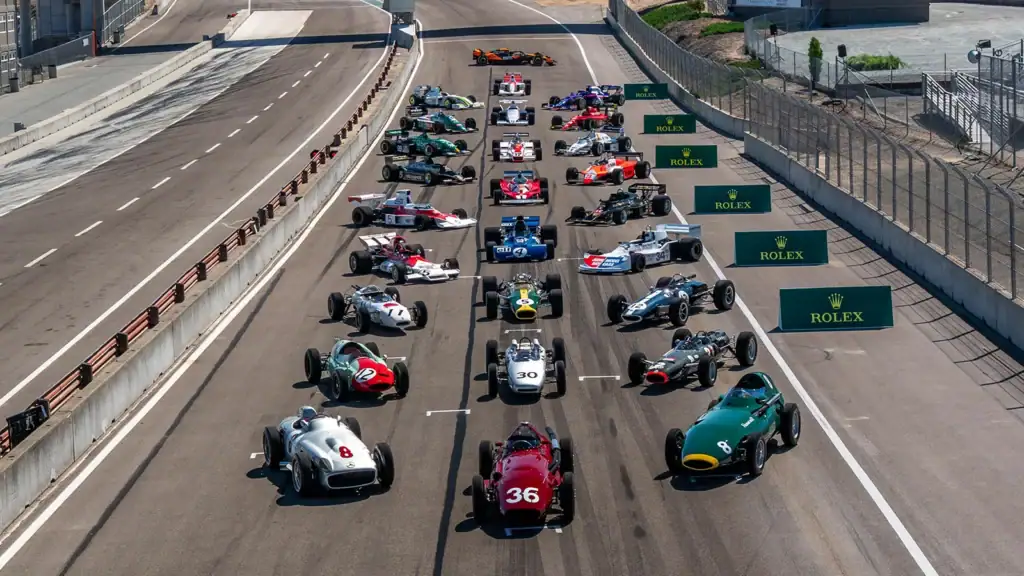 historic open-wheel racers down the start/finish straight at Laguna Seca Raceway