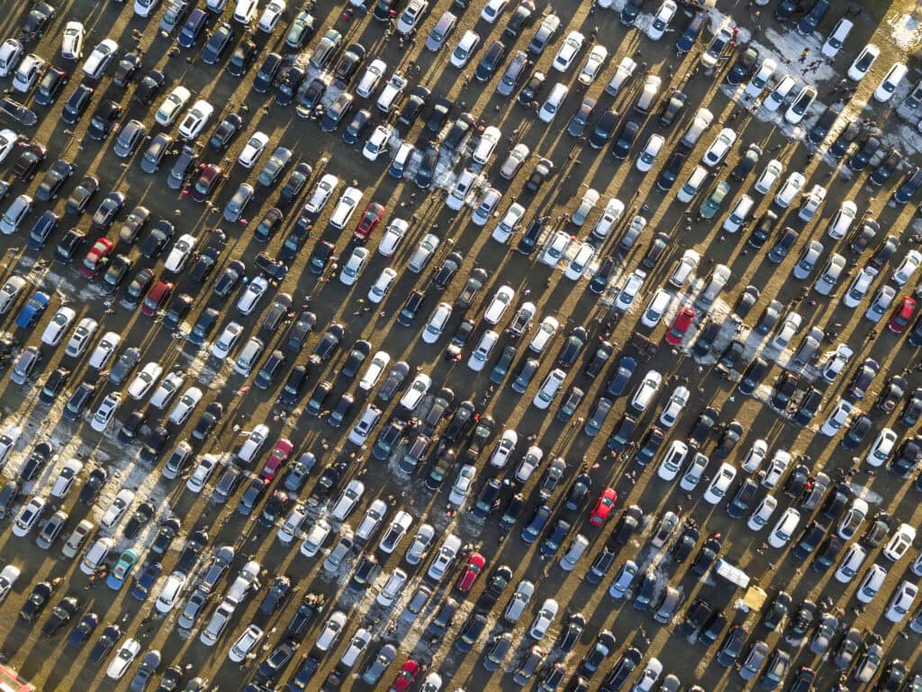 Aerial view of car lot with thousands of cars for sale