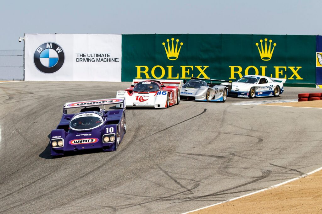 Porsche 962-era prototypes attacking the Corkscrew