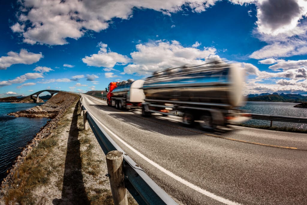 Diesel tanker with tanker trailer, heading to a gas station at speed